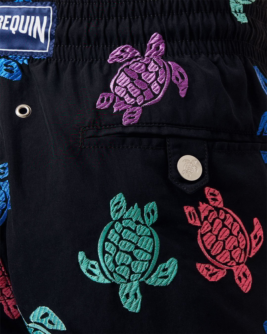Focus on swimwear with a turtle pattern.